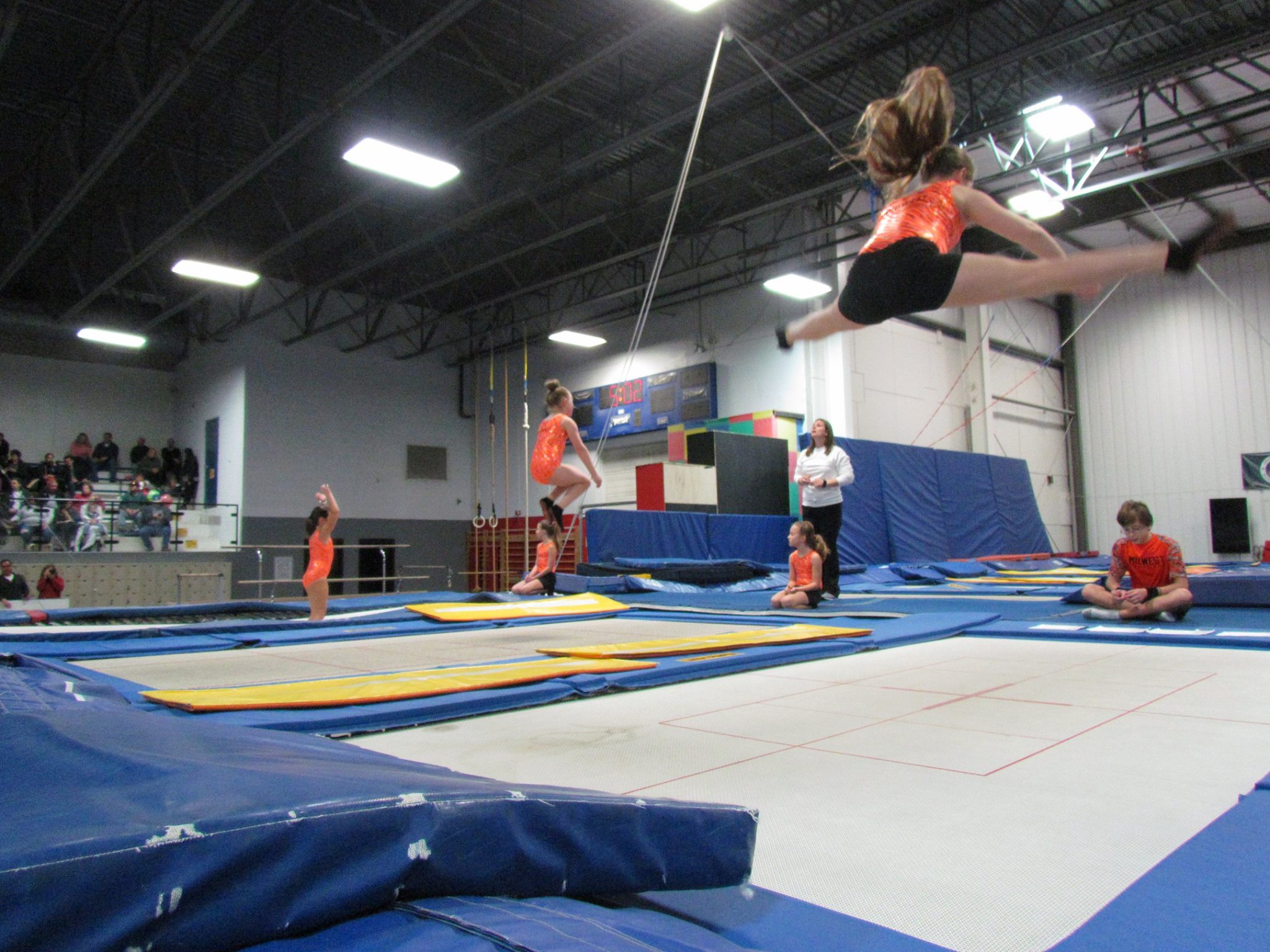 Girls jumping on a gymnastic trampoline